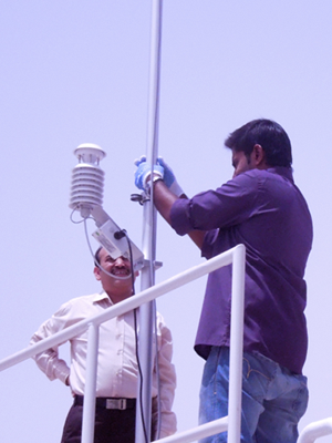 Maintenance engineer servicing instruments